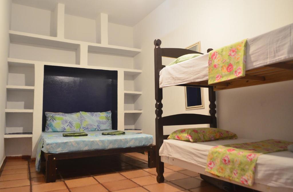Cama ou camas em um quarto em Cabo Frio Fun Hostel