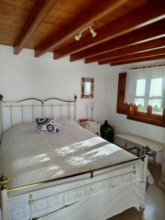 Postel nebo postele na pokoji v ubytování Manos House in Chora