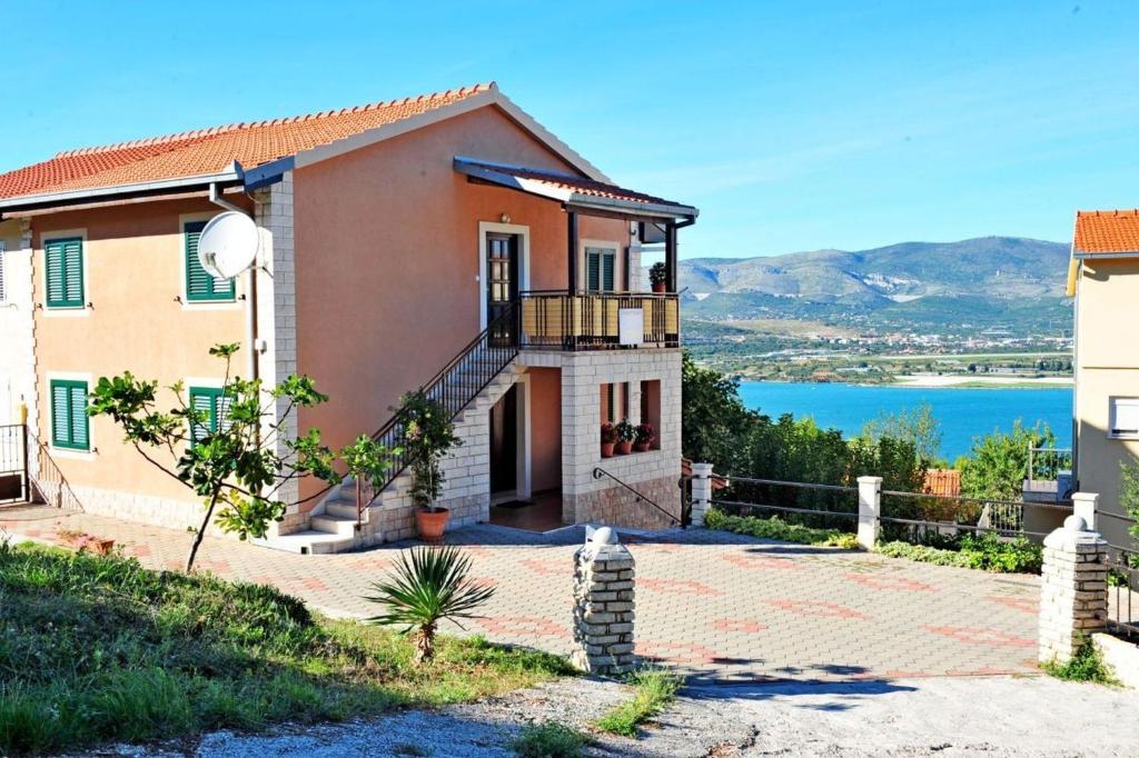 a house with a view of the water at Blue Horizon Retreat in Trogir