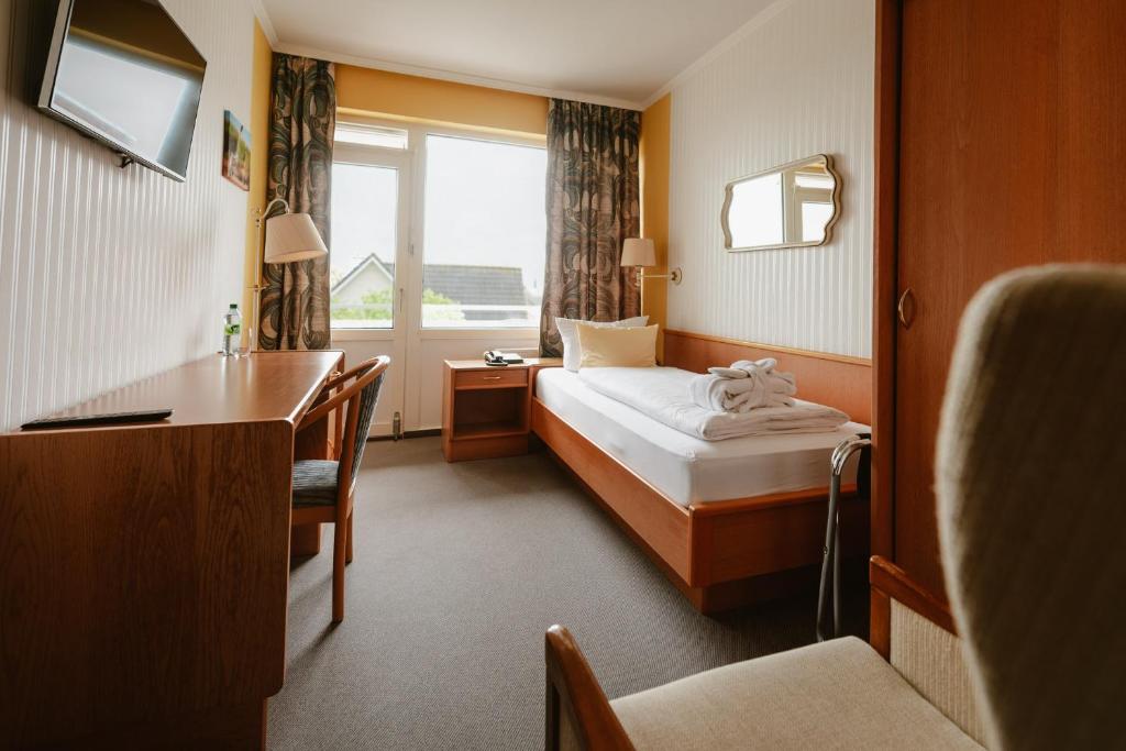 Postel nebo postele na pokoji v ubytování Hotel das Miramar