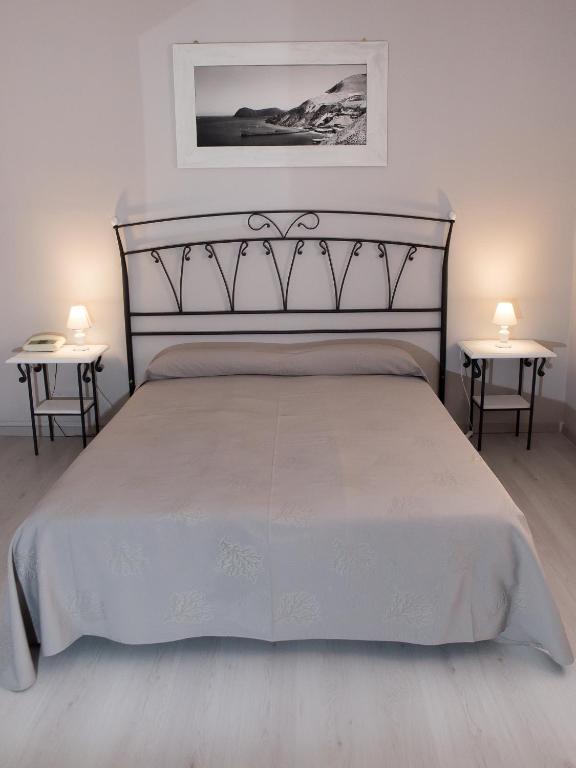 Postel nebo postele na pokoji v ubytování Hotel Odissea
