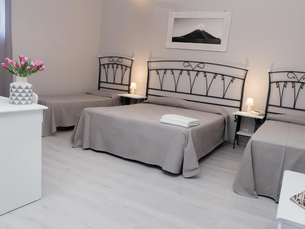 Postel nebo postele na pokoji v ubytování Hotel Odissea