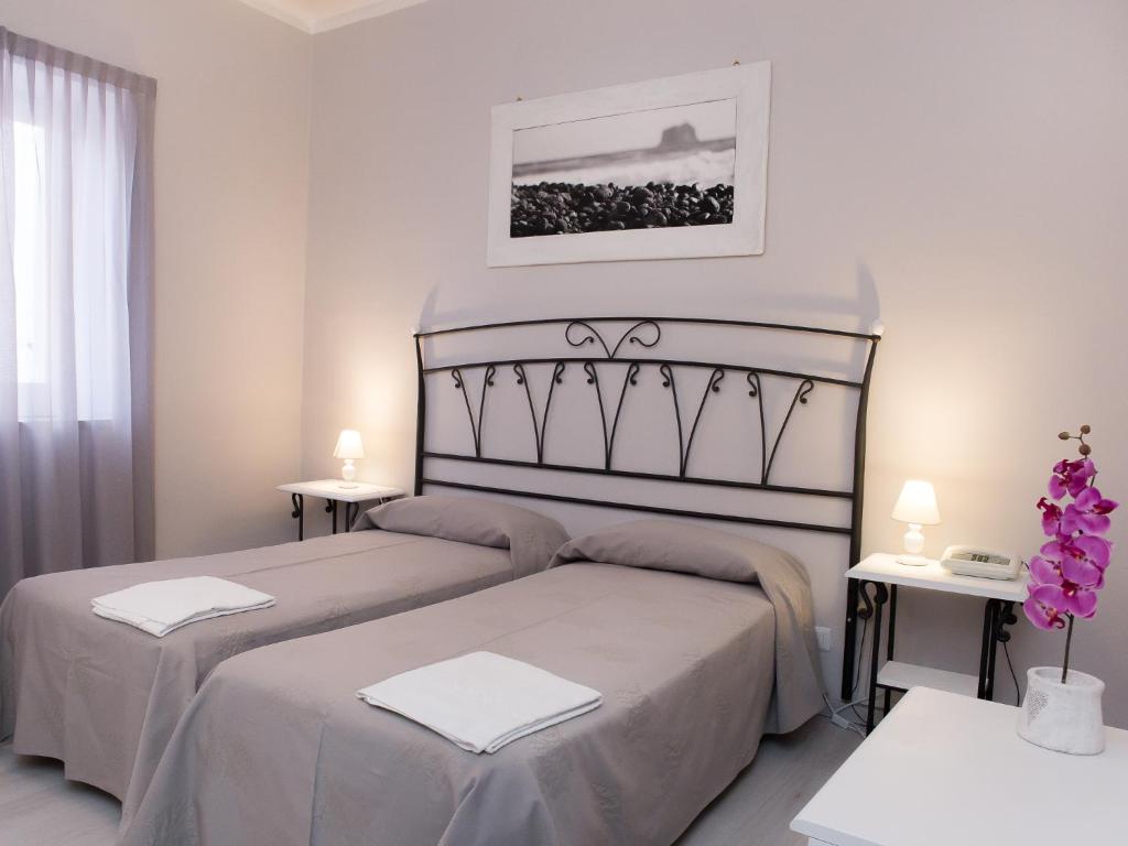 Postel nebo postele na pokoji v ubytování Hotel Odissea