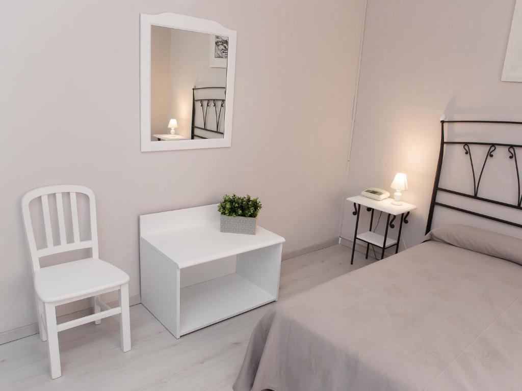Postel nebo postele na pokoji v ubytování Hotel Odissea
