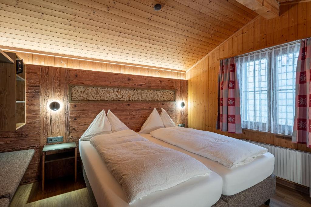 Letto o letti in una camera di Chalet Stöckli