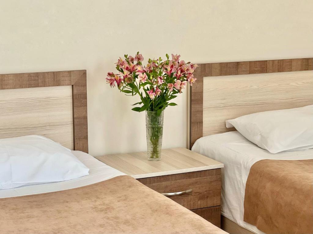 Postel nebo postele na pokoji v ubytování Hotel Mireosi