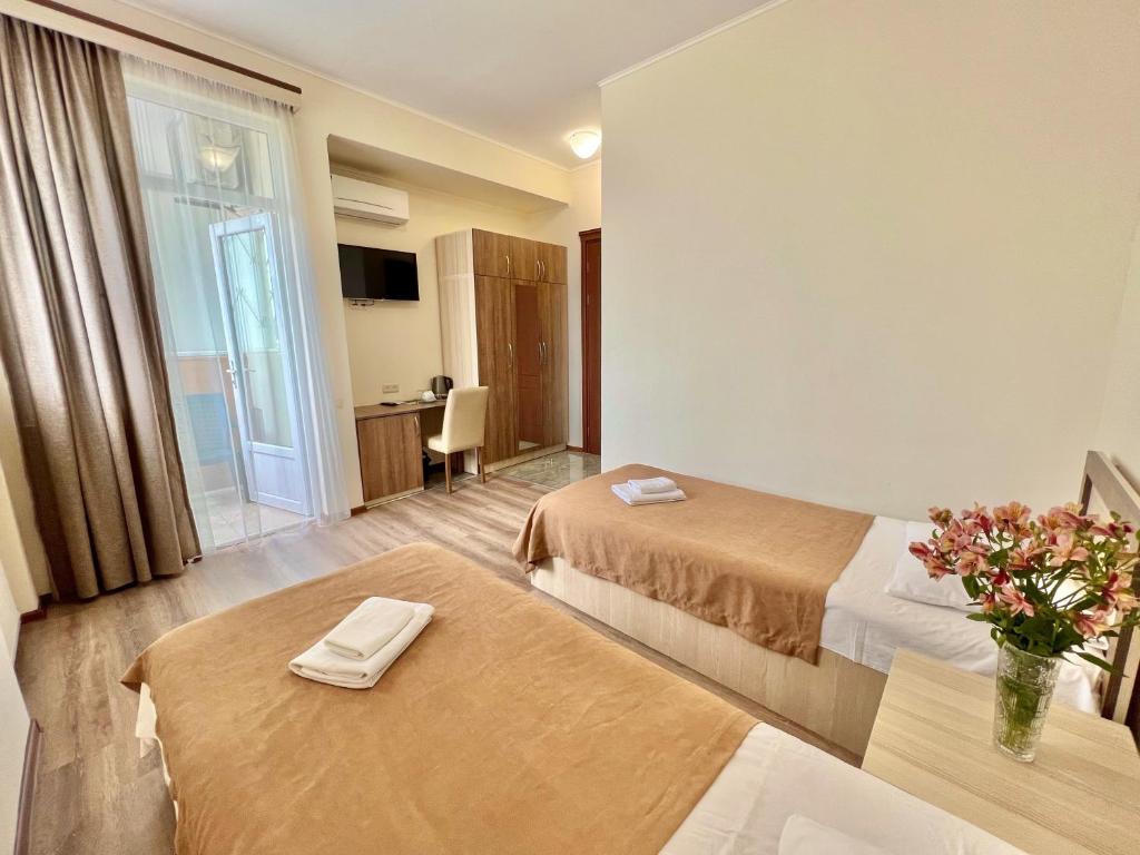 Postel nebo postele na pokoji v ubytování Hotel Mireosi
