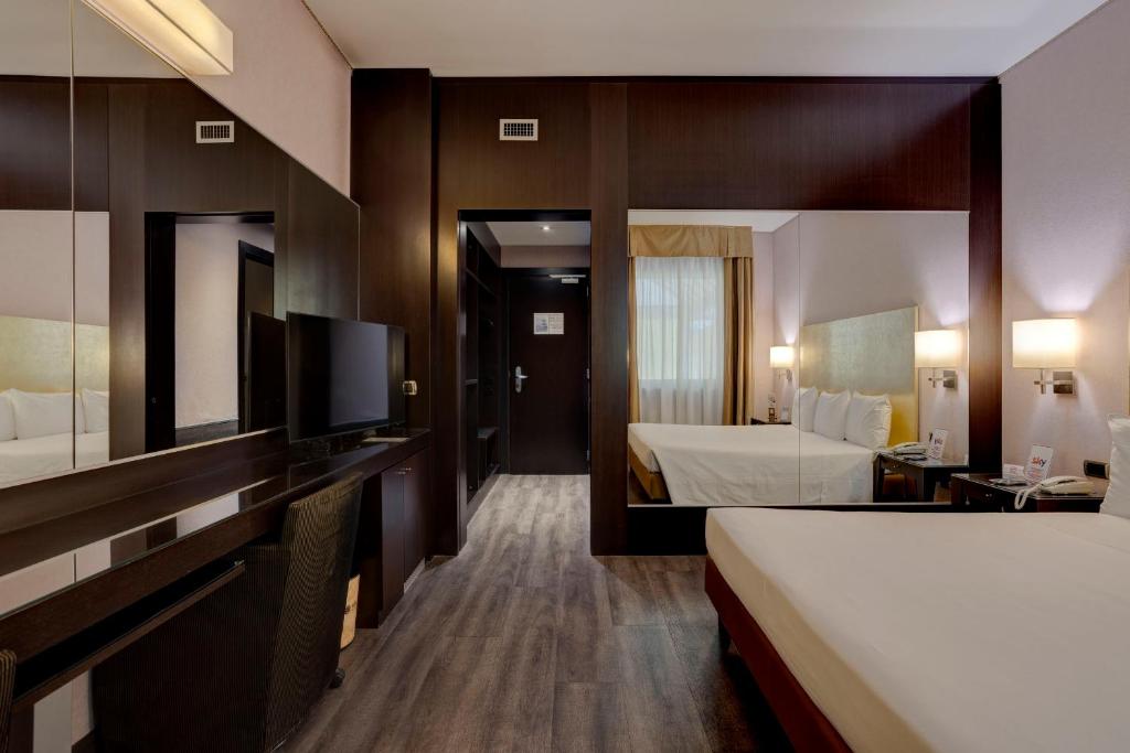 Postel nebo postele na pokoji v ubytování Hotel Nord