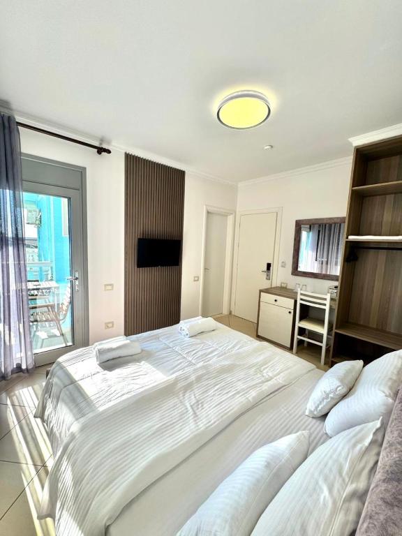 Postel nebo postele na pokoji v ubytování Hotel Abedini