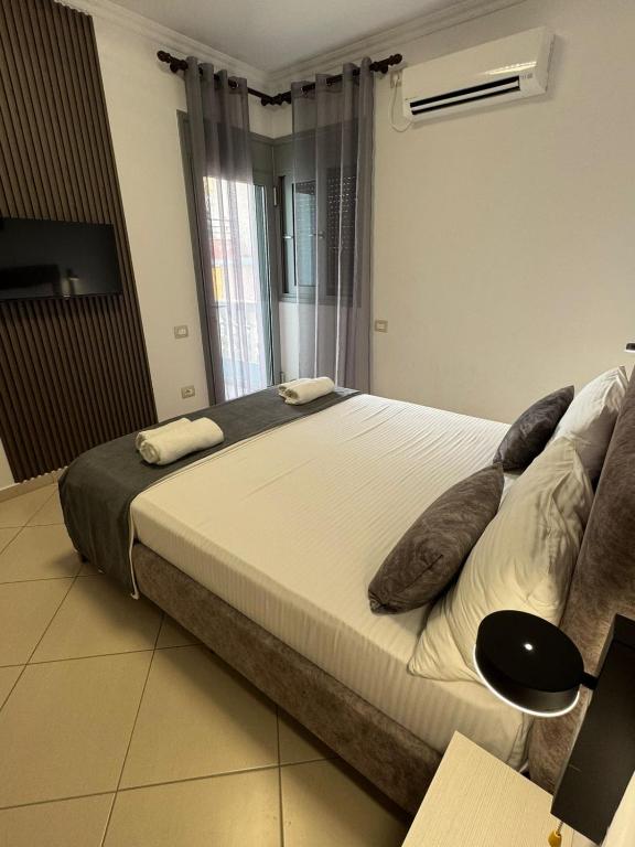 Postel nebo postele na pokoji v ubytování Hotel Abedini