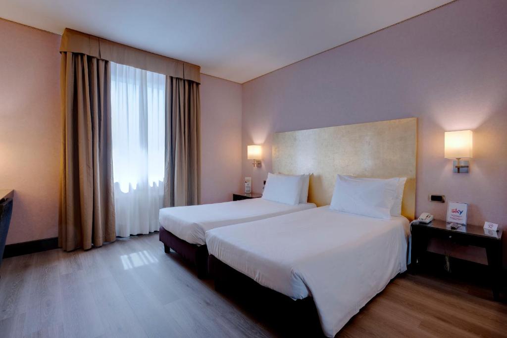 Postel nebo postele na pokoji v ubytování Hotel Nord