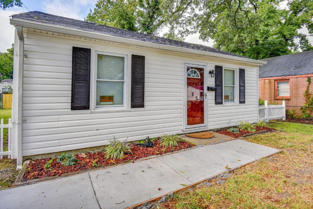 a white house with a red door at Hampton Vacation Rental Central Location, Patio in Hampton