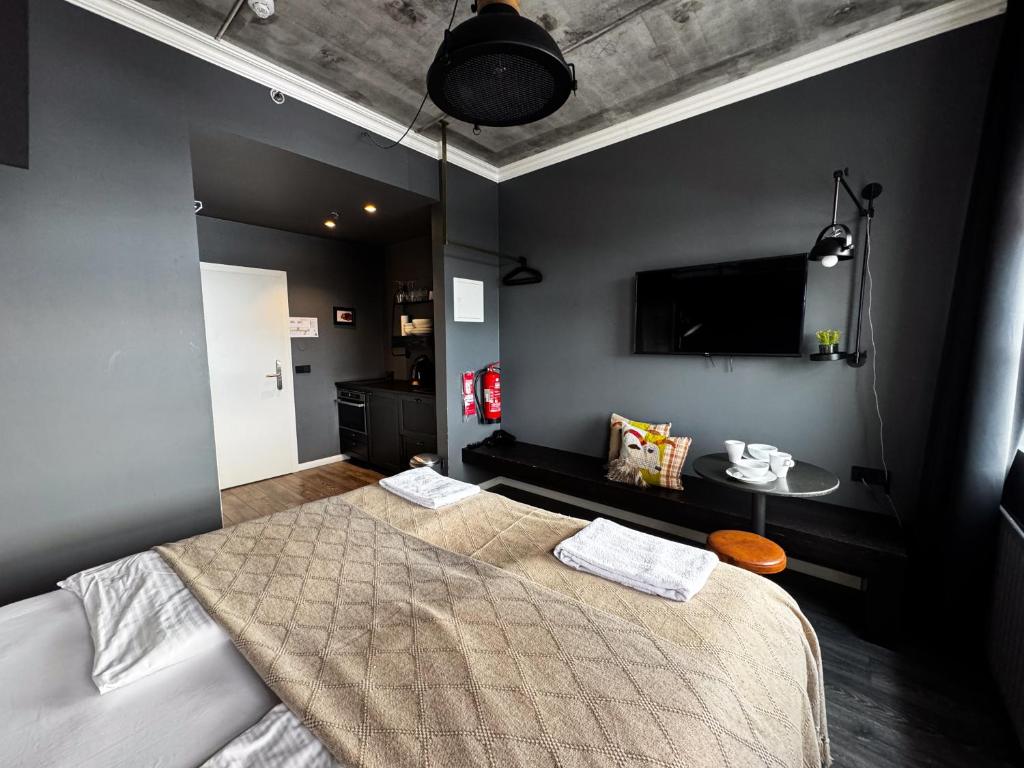 Postel nebo postele na pokoji v ubytování R13 - A Townhouse Hotel