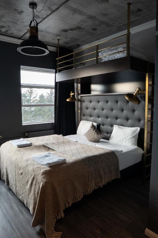 Postel nebo postele na pokoji v ubytování R13 - A Townhouse Hotel