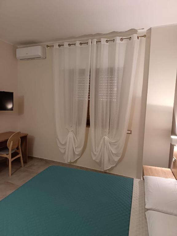 Postel nebo postele na pokoji v ubytování I Colori del Vento