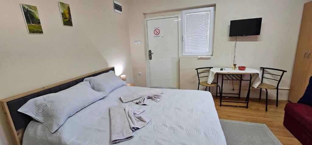 Postel nebo postele na pokoji v ubytování Apartmani Jasminka