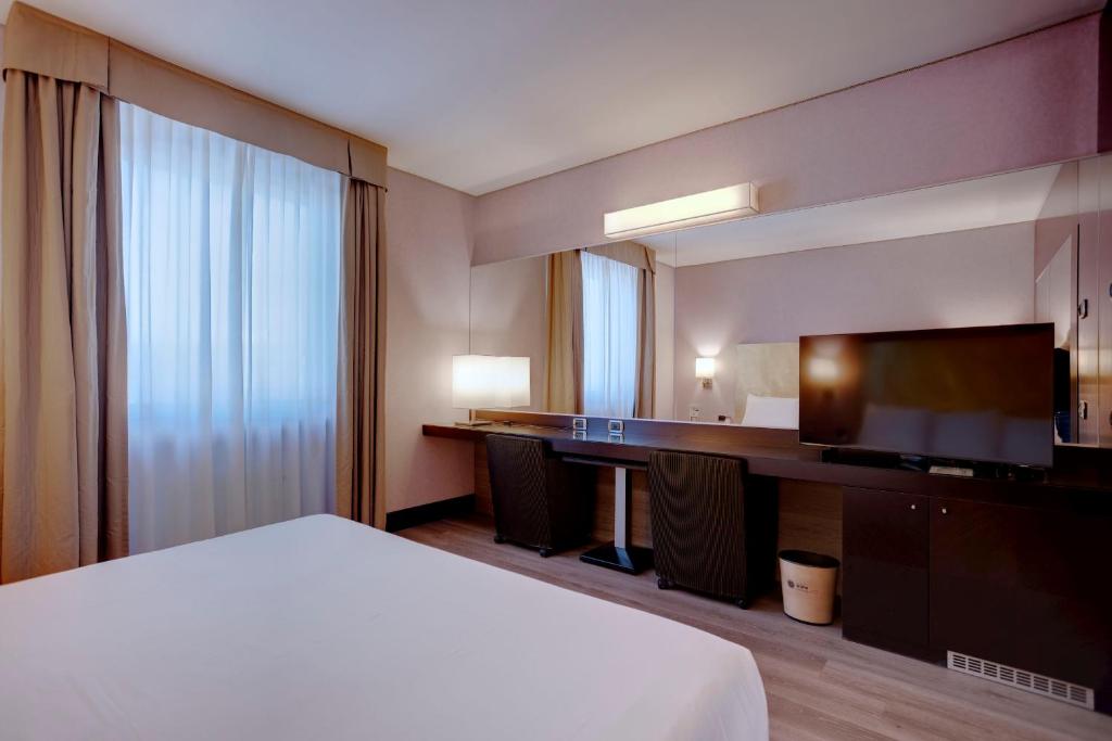 Postel nebo postele na pokoji v ubytování Hotel Nord