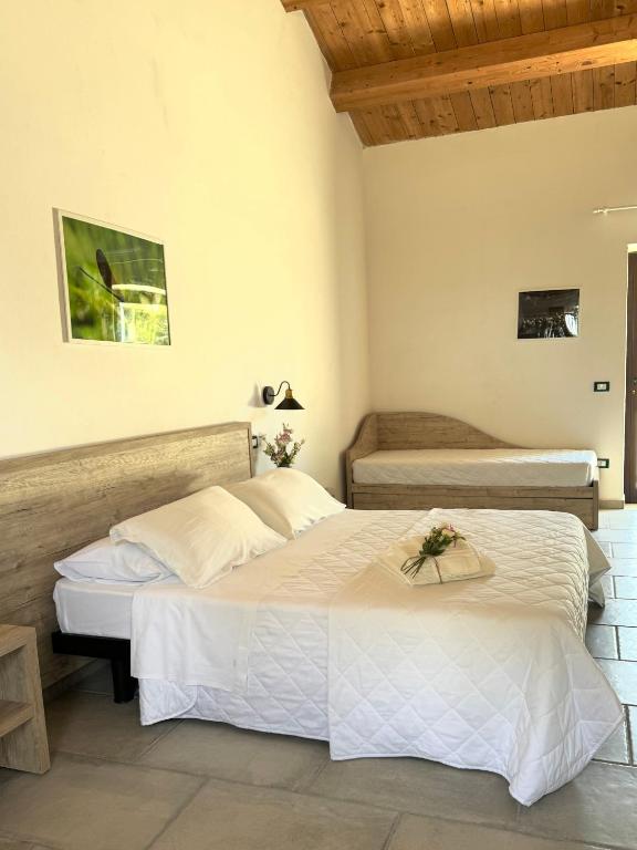 a bedroom with two beds in a room at Bosco Elda in San Giovanni Rotondo