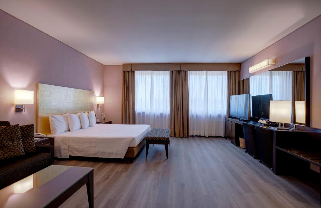 Postel nebo postele na pokoji v ubytování Hotel Nord