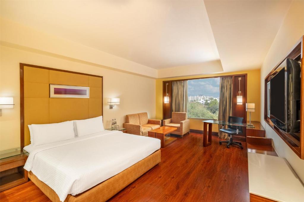 Postel nebo postele na pokoji v ubytování Park Inn Gurgaon