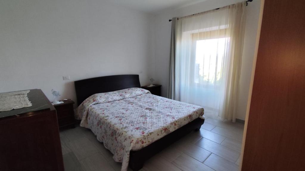 Ένα ή περισσότερα κρεβάτια σε δωμάτιο στο Bellavista