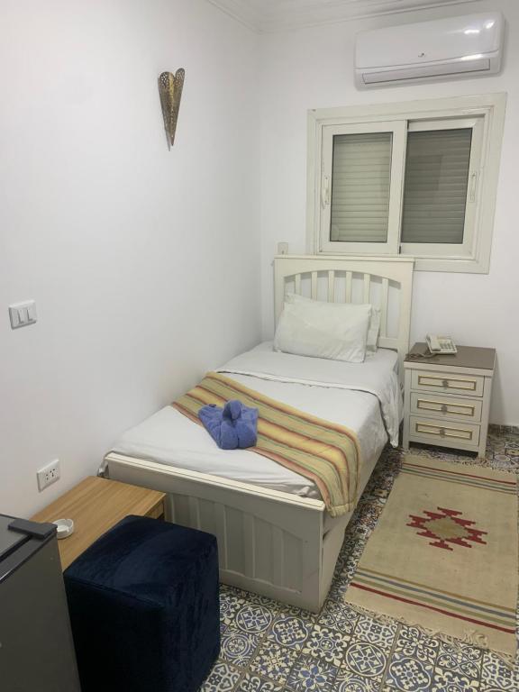 Postel nebo postele na pokoji v ubytování Z Pyramids Inn