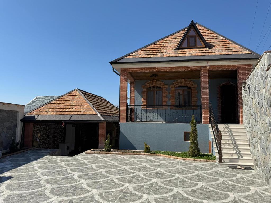 a large brick house with a tile roof at Burj Sheki in Sheki