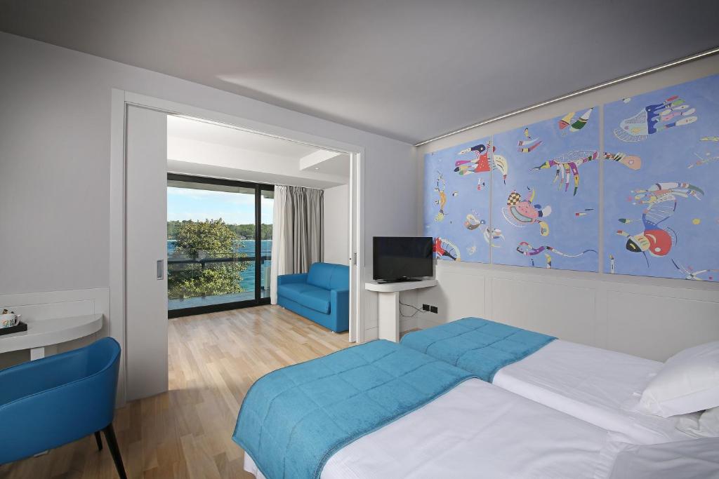 Postel nebo postele na pokoji v ubytování Hotel Salò du Parc