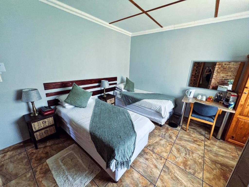 Postel nebo postele na pokoji v ubytování Agros Guest House