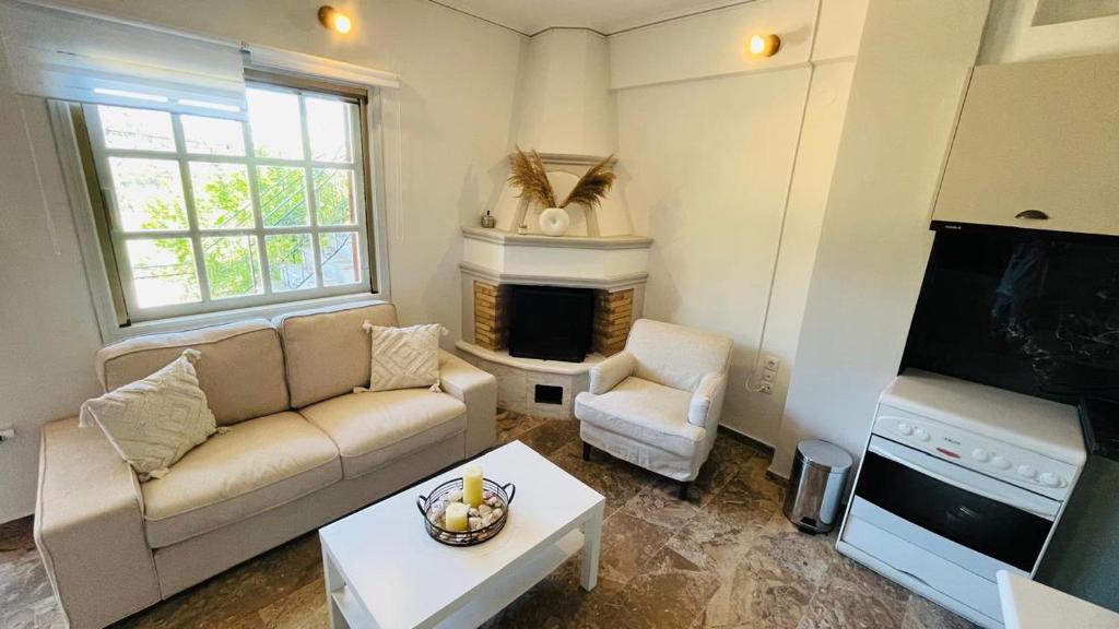 a living room with a couch and a fireplace at Villaggio View in Kariá