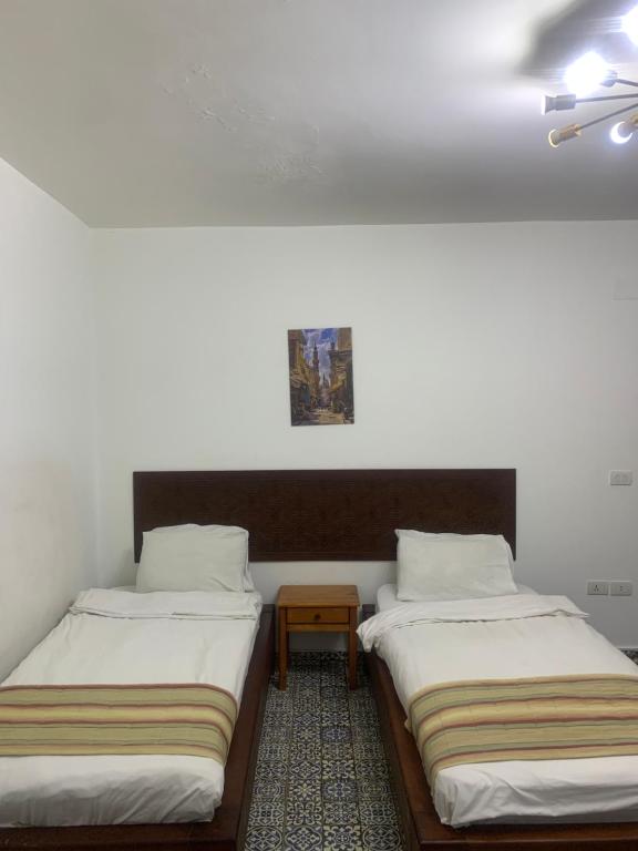 Postel nebo postele na pokoji v ubytování Z Pyramids Inn