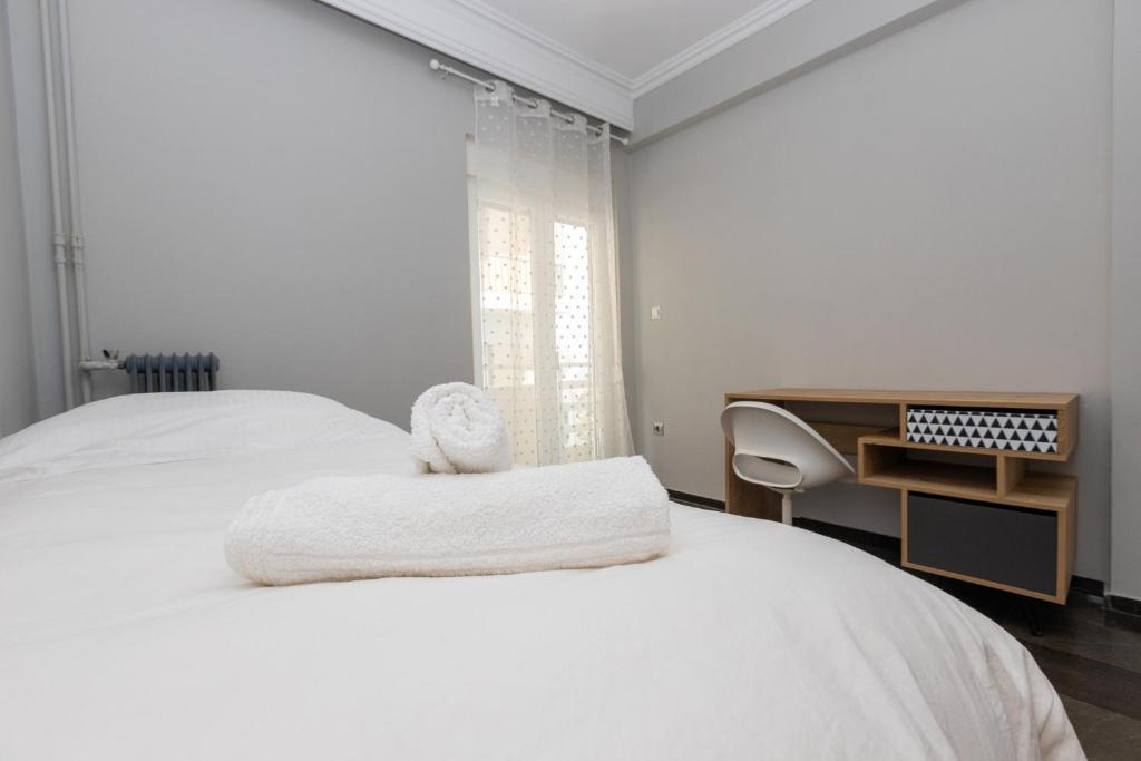 A bed or beds in a room at Panoramic Apartment