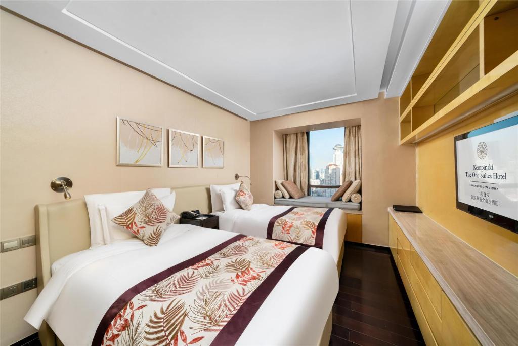 Postel nebo postele na pokoji v ubytování Kempinski The One Suites Hotel Shanghai Downtown