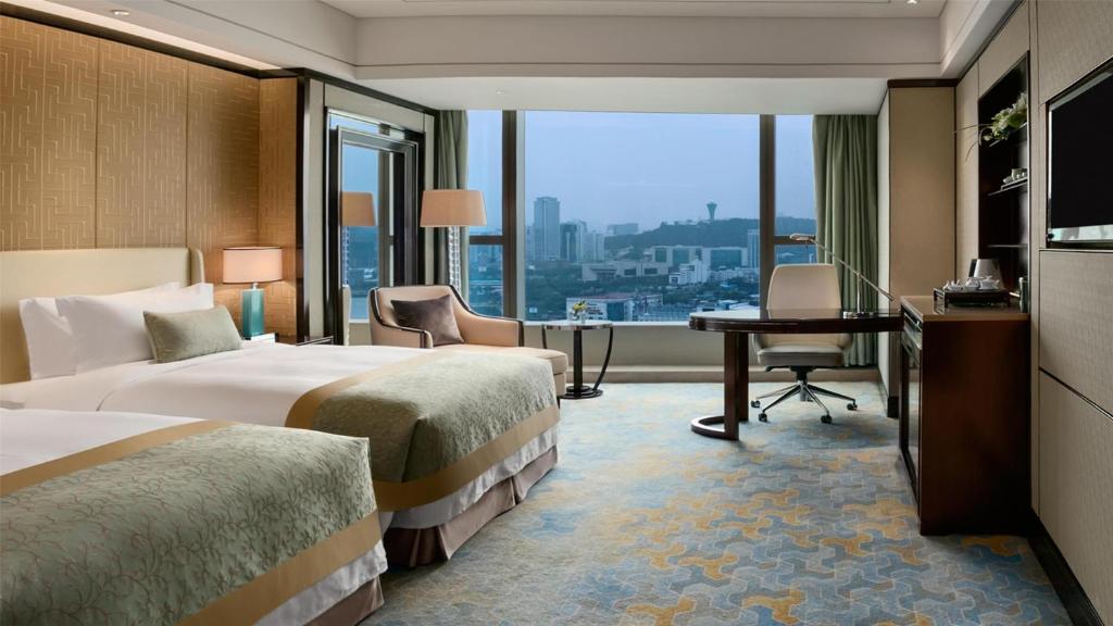 Postel nebo postele na pokoji v ubytování Kempinski Hotel Xiamen