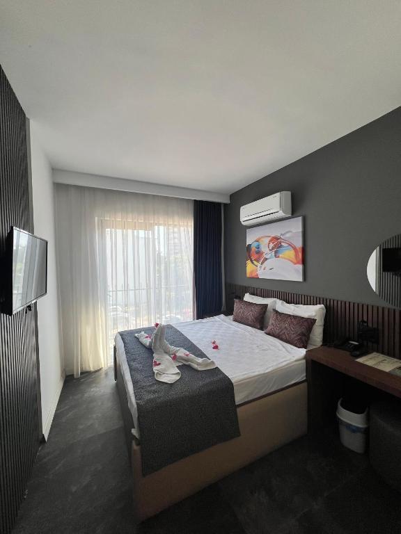 Postel nebo postele na pokoji v ubytování Wolf Of The City Hotel & Spa