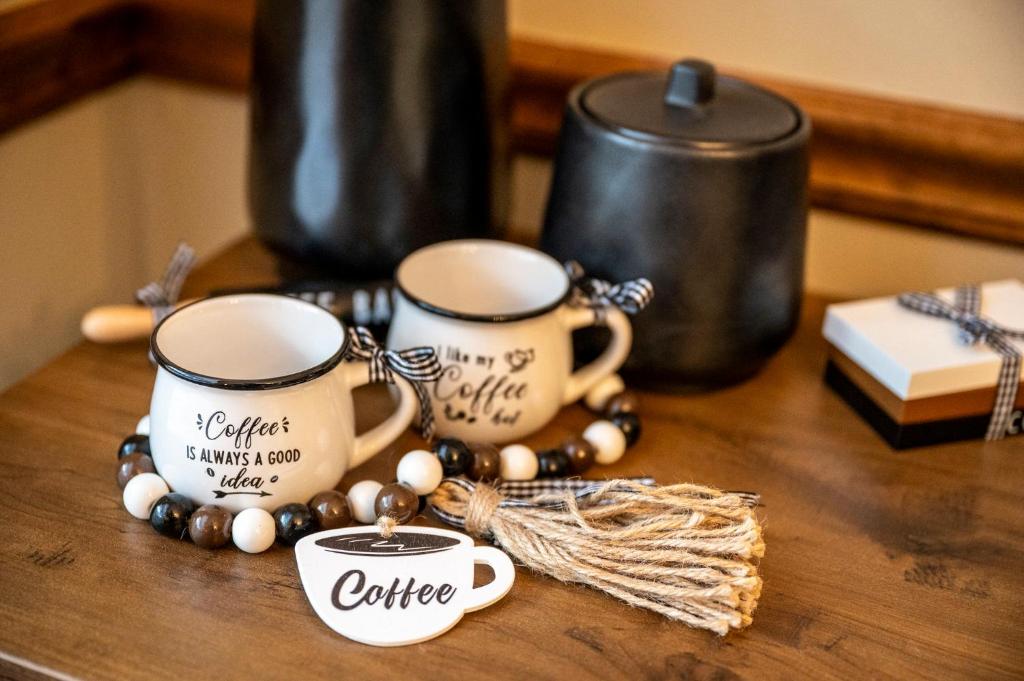 a table with two coffee cups and a bunch of beads at Lazy Dayz by Avada Properties in Pigeon Forge