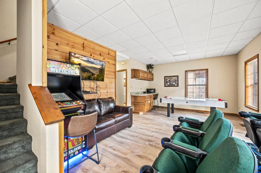 a living room with a ping pong table at Lazy Dayz by Avada Properties in Pigeon Forge