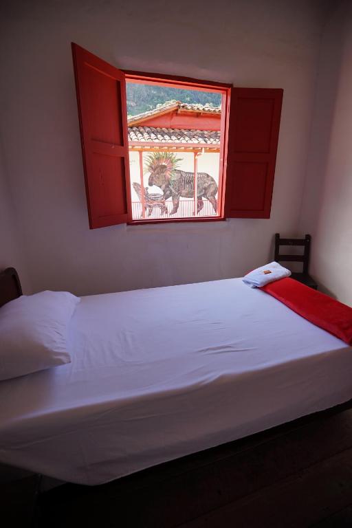 Postel nebo postele na pokoji v ubytování La Oculta Hostal