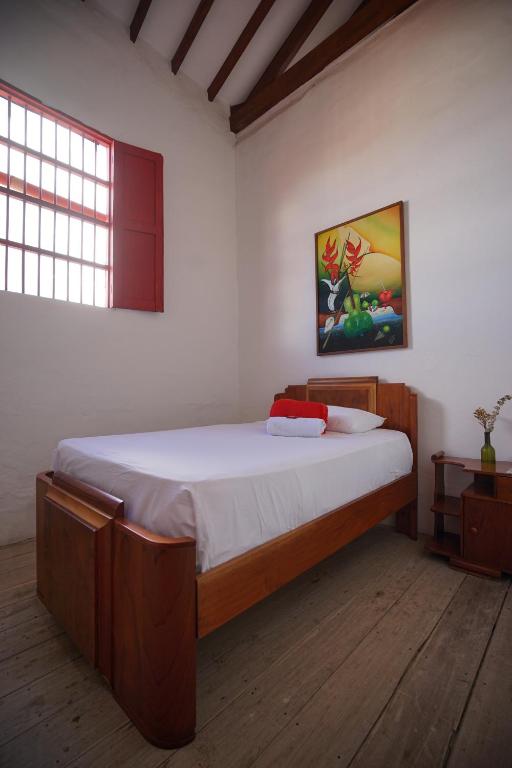 Postel nebo postele na pokoji v ubytování La Oculta Hostal