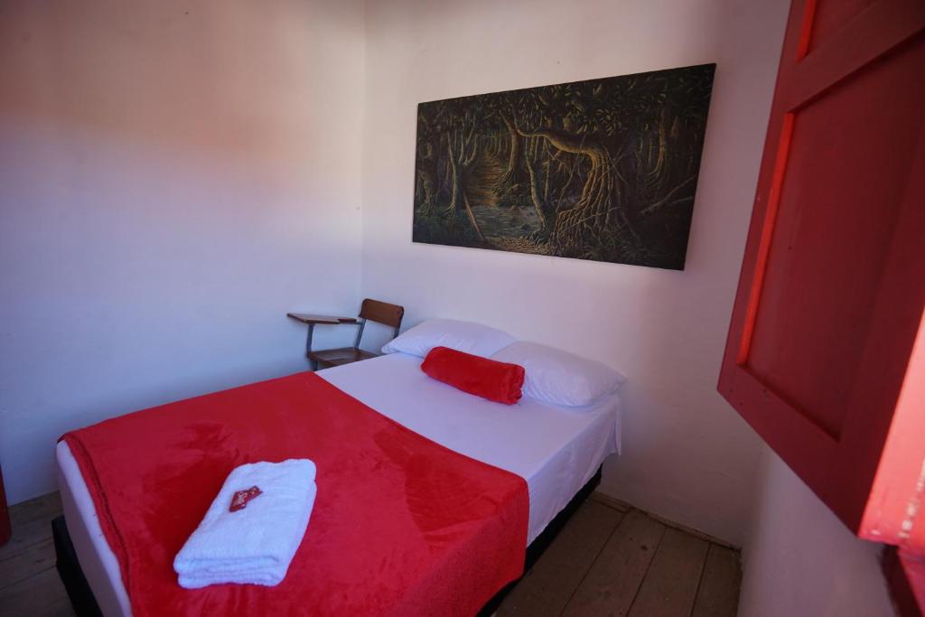 Postel nebo postele na pokoji v ubytování La Oculta Hostal