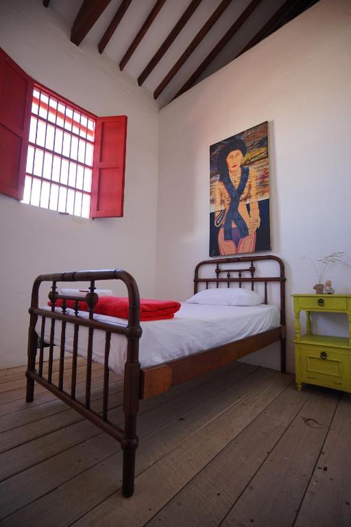 Postel nebo postele na pokoji v ubytování La Oculta Hostal