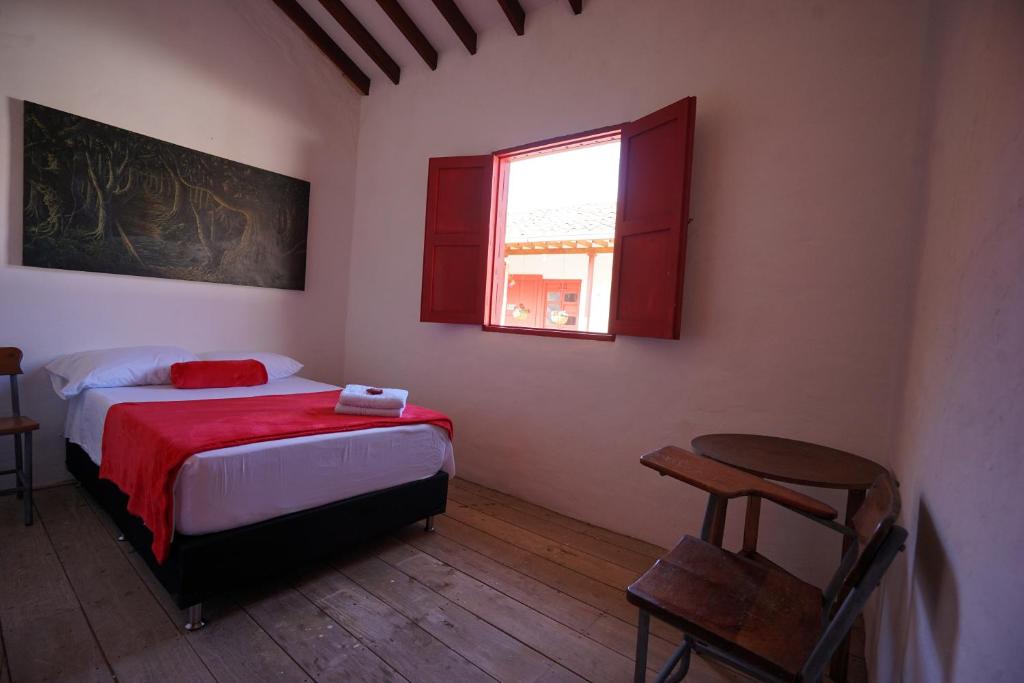 Postel nebo postele na pokoji v ubytování La Oculta Hostal