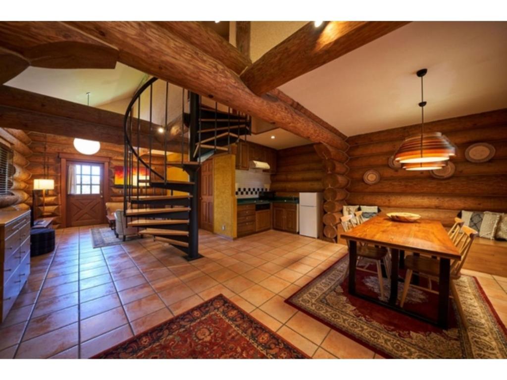 a large room with wooden walls and a spiral staircase at Fiore Shima - Vacation STAY 25653v in Shima