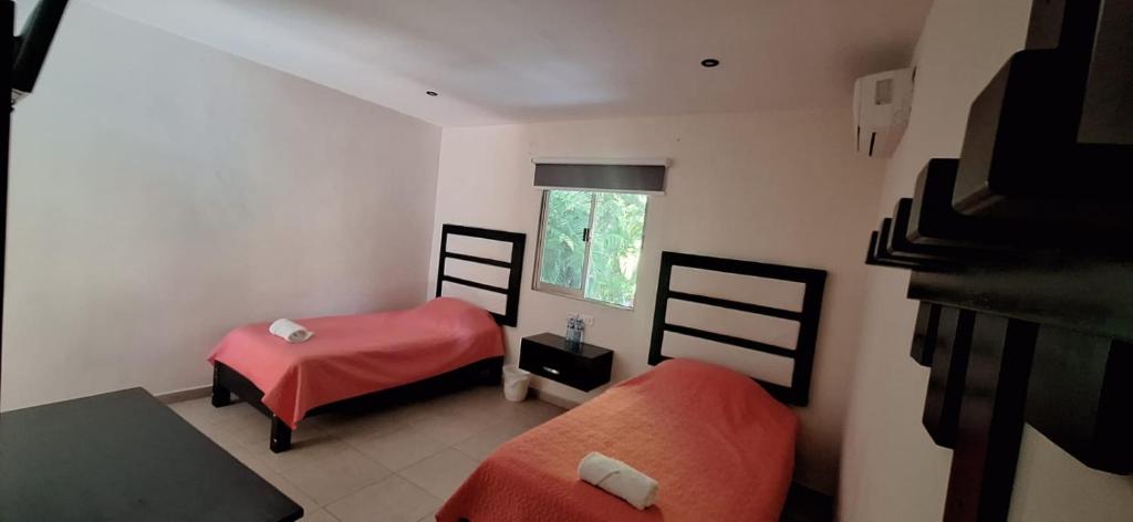 Postel nebo postele na pokoji v ubytování Hotel Sevilla Palenque