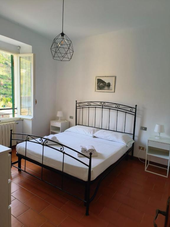 A bed or beds in a room at Camere Toni