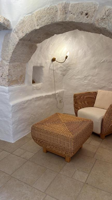 Posezení v ubytování Trulli Oiseaux Migrateurs