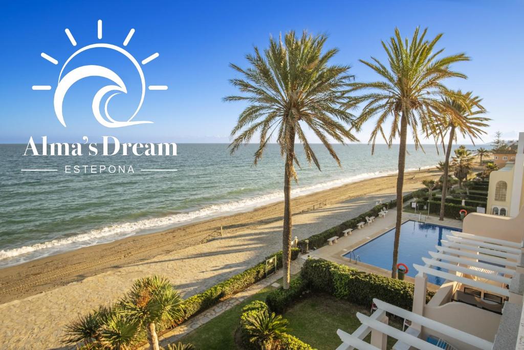 a view of the beach from the balcony of an almas dream resort at Alma's Dream Estepona in Estepona