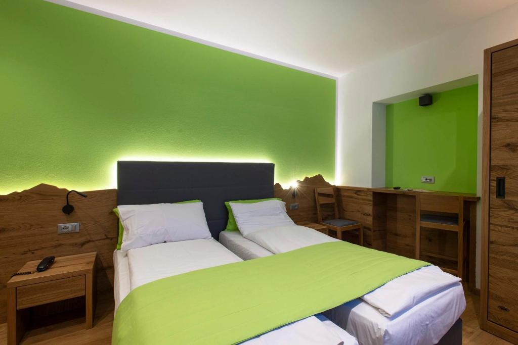 Postel nebo postele na pokoji v ubytování Hotel Angelo