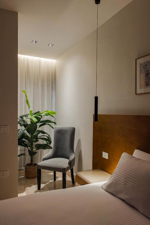 Postel nebo postele na pokoji v ubytování Elegance Tower