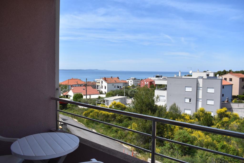 a balcony with a view of the ocean at Apartman KiP in Zadar